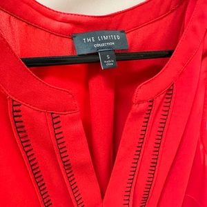 Limited Red sleeveless blouse with black trim